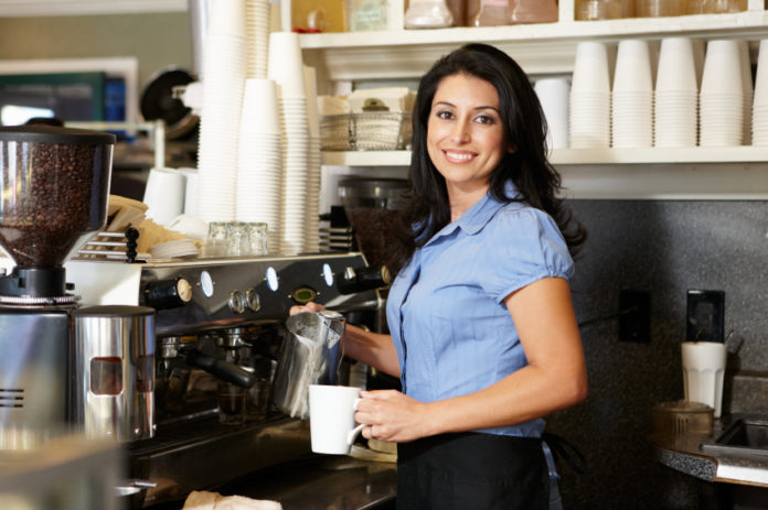 Woman working in coffee shop