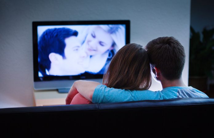 Couple Watching Romantic Movie Together on TV