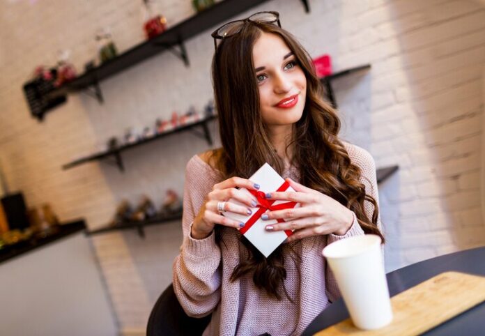 celebrating-woman-stylish-modern-cafe-with-gifts-enjoying-her-birthday-dating_273443-1164